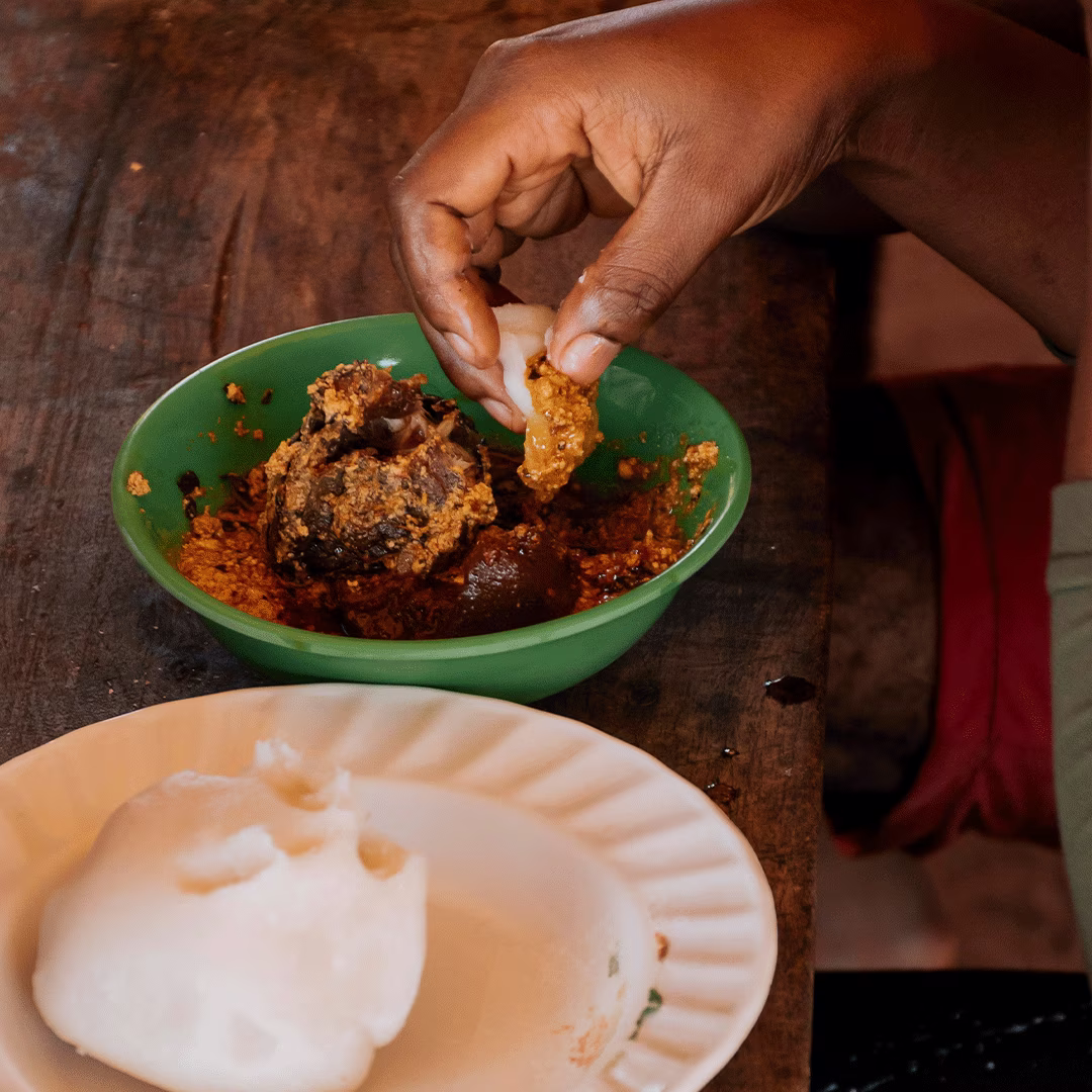 Ugali eaten with a meat stew