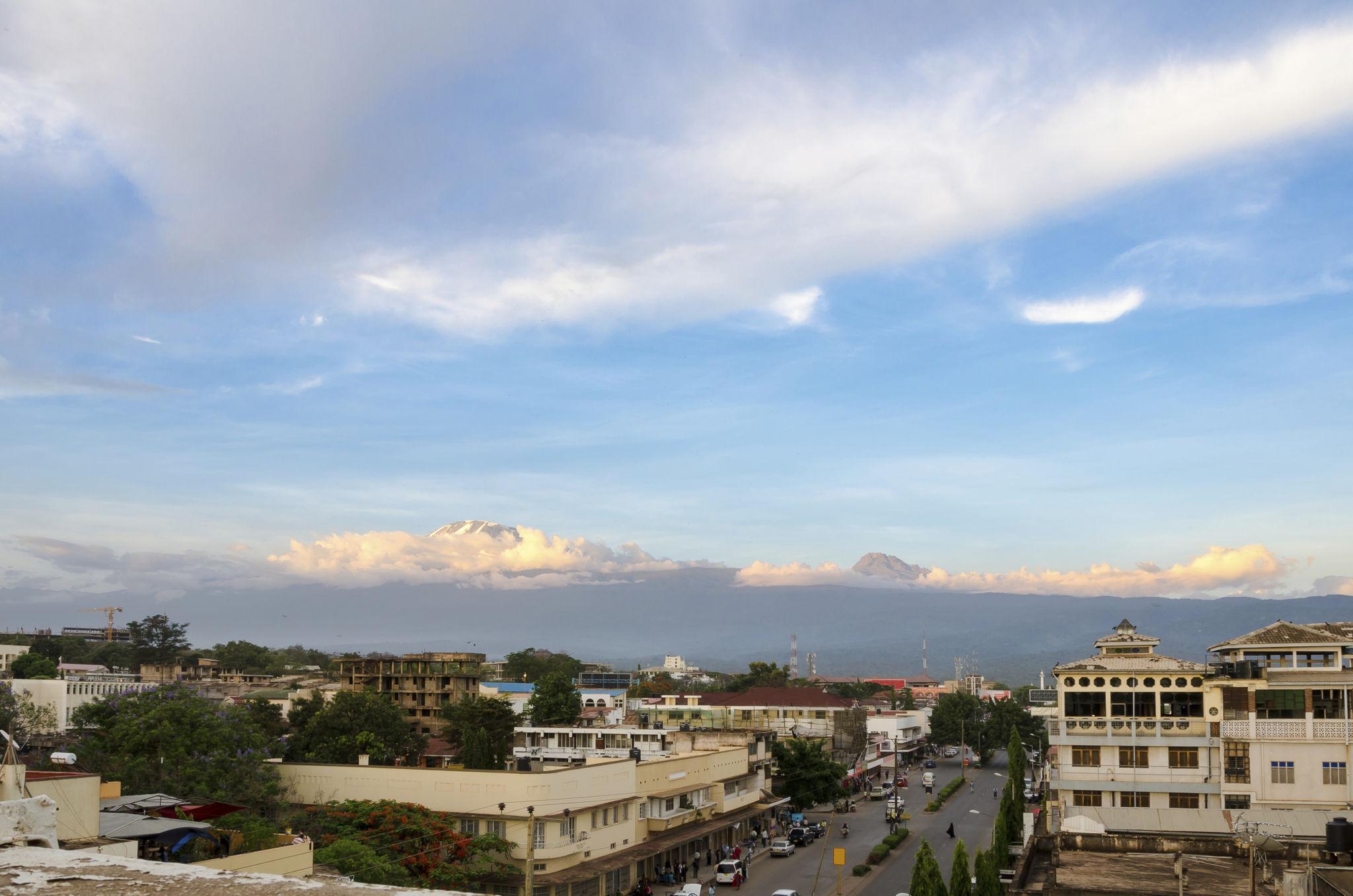 Rooftops of Moshi town with Kilimanjaro's snowy top on the horizon