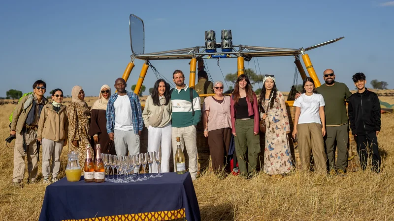 Guests and their guide at a champagne breakfast in the Serengeti